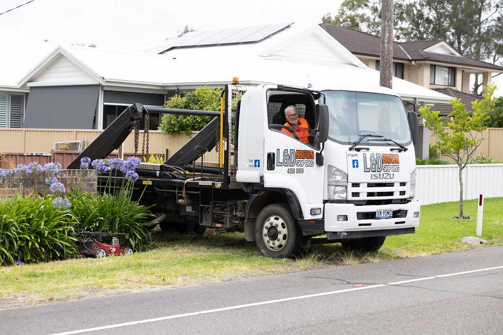 Truck with Loading Crane on Residential Street