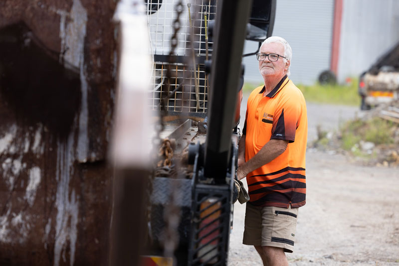 Construction worker operating heavy machinery.