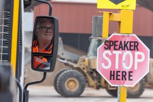 Skip Bin Worker Visible in Truck Mirror During Hire Service in Central Coast